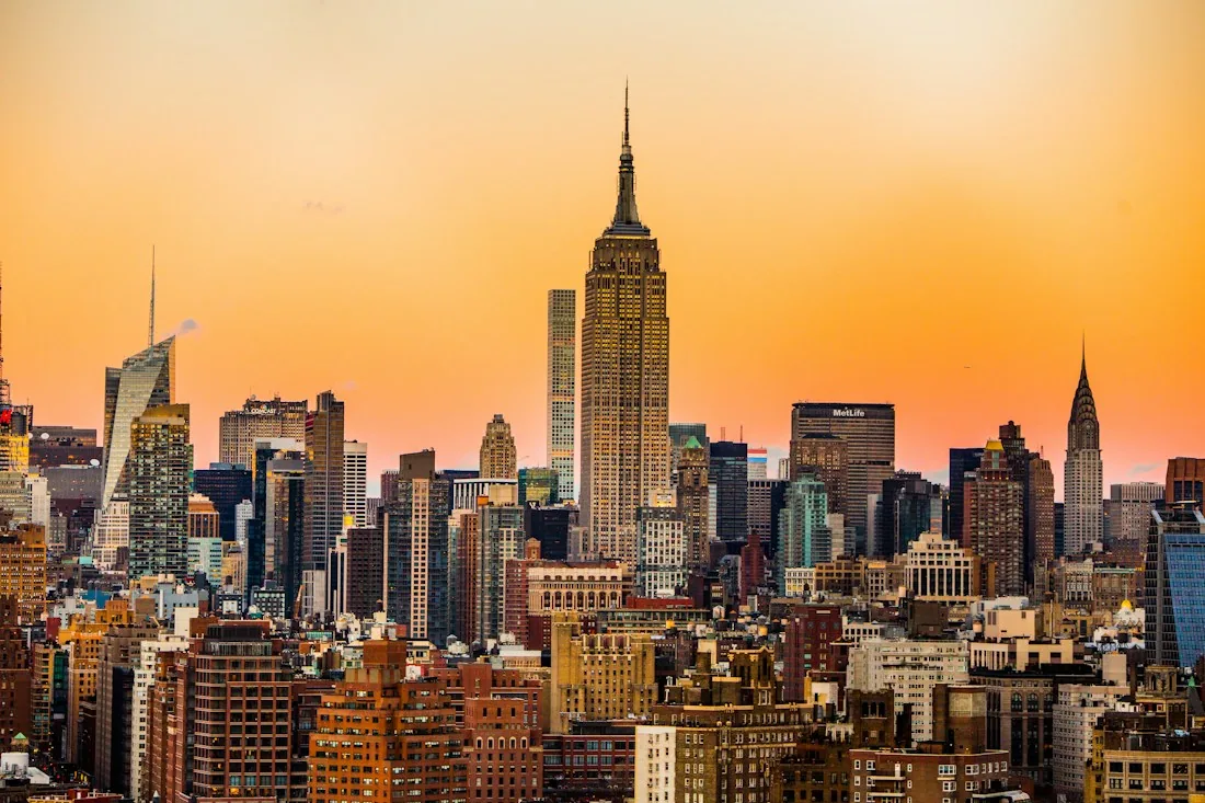 The New York City skyline in golden evening light